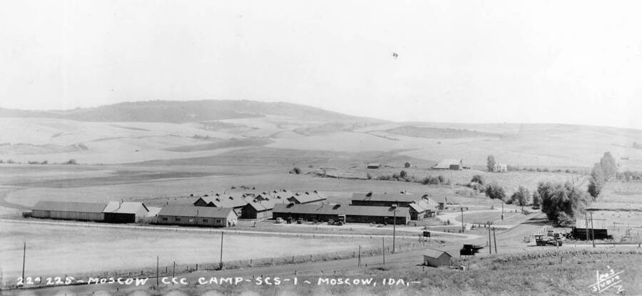 View of CCC Camp SCS-1 near Moscow, Idaho. The writing on the photo reads: '22-225 Moscow CCC Camp SCS-1 Moscow, IDA.' The back of the photo reads: '25-13-48 Leo's Studio [unidentifiable name] of N. Idaho Moscow'.