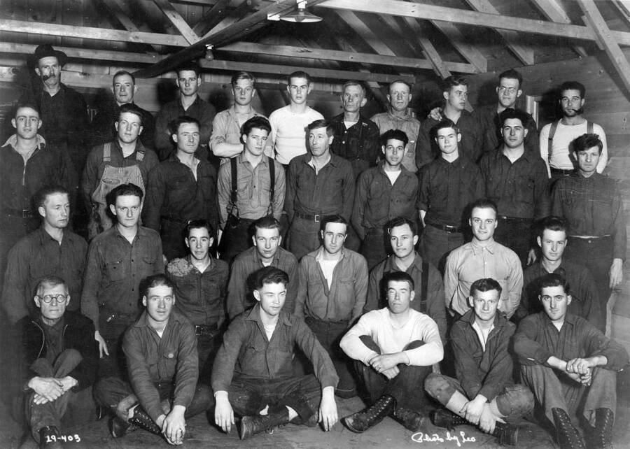 Group portrait of Camp Troy personnel, Company 244, Troy, Idaho. Writing on photo reads '19-403 Photo by Leo'.
