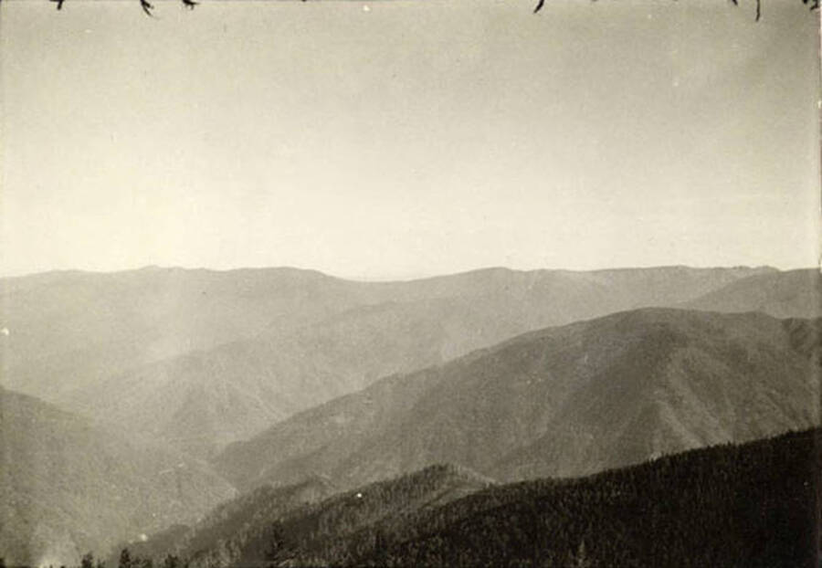 A photograph of the landscape outside of the CCC Camp. Back of the photo reads: 'Scenery shot of Idaho'.