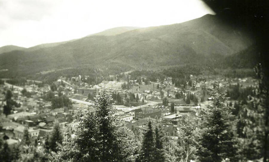 An overview of a city near CCC Camp Big Creek #2, F-132. Could be Prichard or Wallace. Forested hills rise in the background.