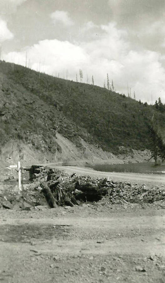 The road that leads away from  CCC Camp Big Creek #2, F-132. Back of the photo reads: 'The road 'home' from camp to Wallace, Idaho; about 35 miles.'