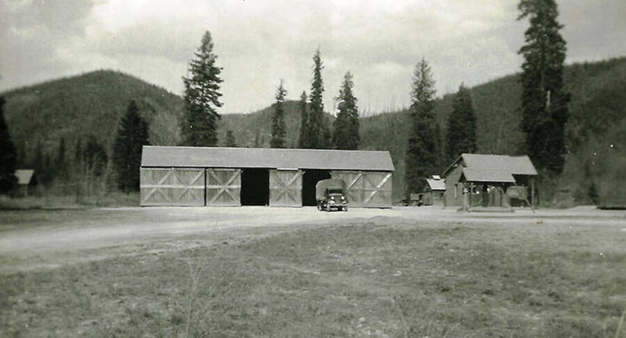 A view of the truck garage at CCC Camp Big Creek #2, F-132. Back of the photo reads: 'Garage for our 5 or 6 trucks'.