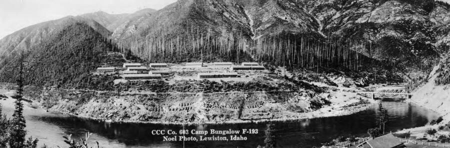 Panoramic view of CCC Camp Bungalow, F-193, Company 603 and the Clearwater River. (postcard view) Near Jaype and Pierce, Idaho.
