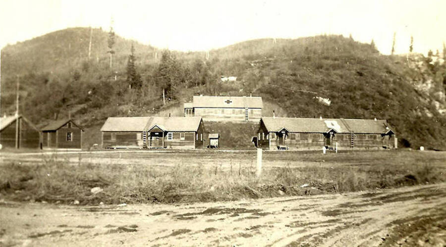 View of several buildings, including an infirmary, at a CCC Camp.