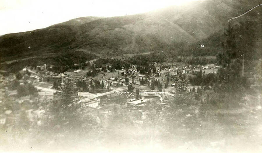 An overview of Mullan, Idaho. Back of photo reads: 'photo from Hi-way 10 Now US 570 not sure of my dad's handwriting Mullan, Idaho'