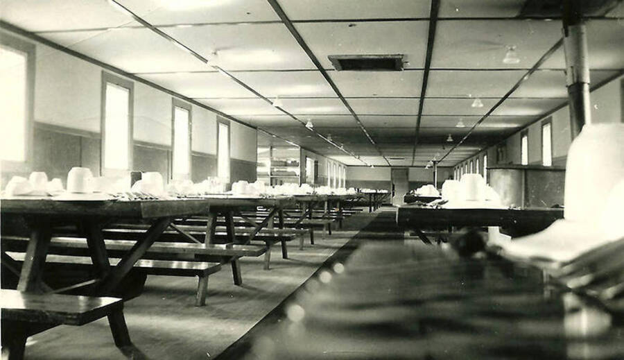 A view of the mess hall at CCC Camp Big Creek #2, F-132. Back of the photo reads: 'Typical mess-hall. Always scrubbed clean and kept neat.'