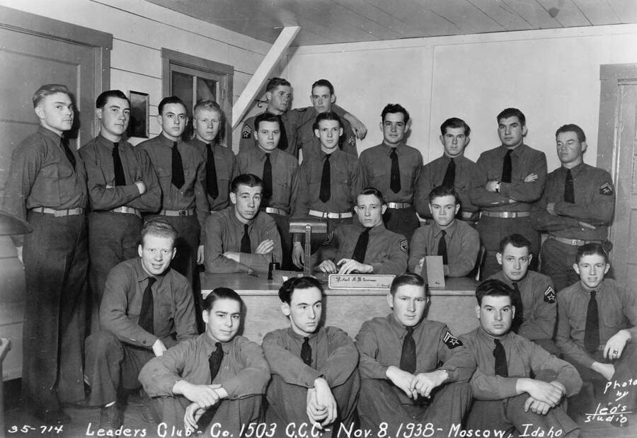 Group of CCC men who are part of the Leaders Club, at camp SCS-1, near Moscow, Idaho. Writing on the photo reads: 'Leaders Club - Company 1503 CCC - November 8, 1938 - Moscow, Idaho Photo by Leo's Studio'.