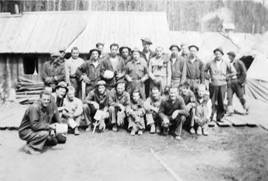 A group of CCC men group in front of a building in a CCC camp. Writing next to the photo reads: 'Tent No. 3'