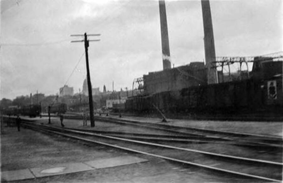 A photo of Chicago, IL taken from a split in the railroad tracks at the train station. Writing under the photo reads: 'Chicago'.