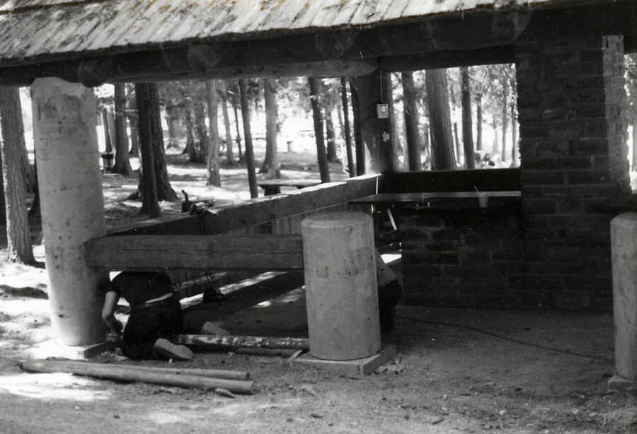 Two men working on the shelter at Heyburn State Park that was built in the 1930s.