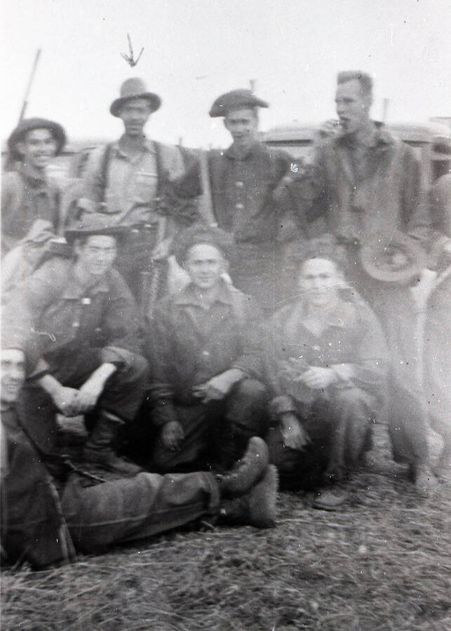 A group of CCC men pose for a group photo. An arrow points to the man in the back row, second from the left.