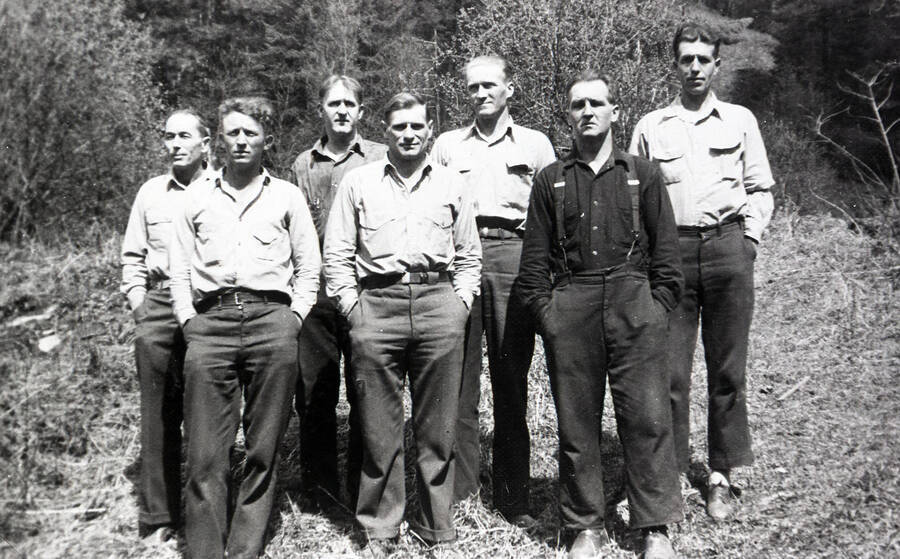 Seven men stand for a photo.  They are all CCC foremen. The 3rd from the right is Towa Ranta (Finnish), 1st from the right is Ralph Hemphill.