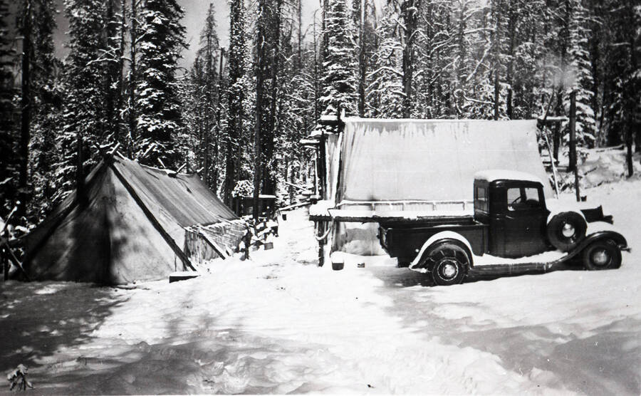 Photo of a CCC tent camp and truck in snow at Green Mountain.