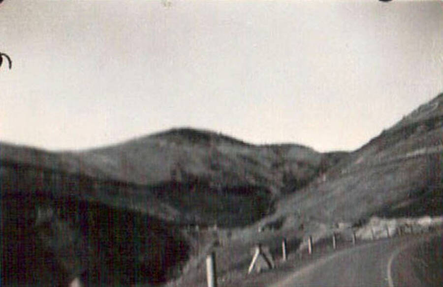 Blurry photo of a road through the hills. Writing under the photo reads: 'Lewiston Hill'