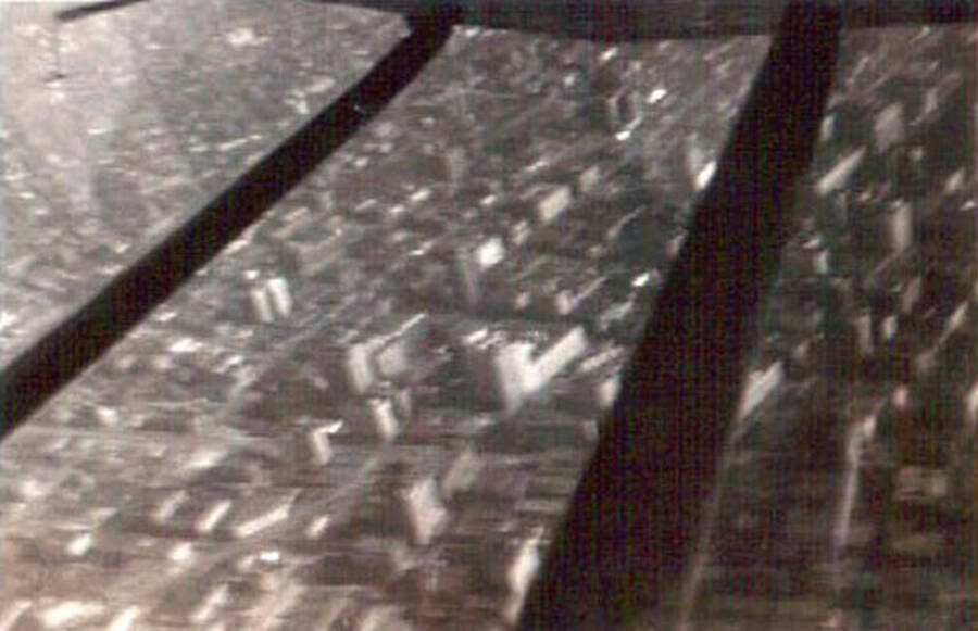 A blurry aerial photo of Seattle from above. Writing under the photo reads: 'Seattle Wash.'