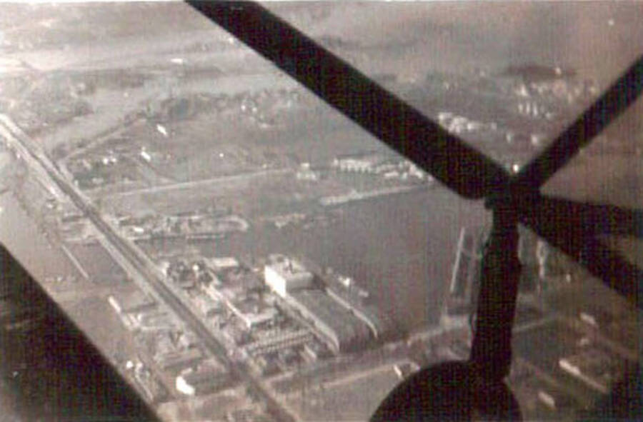 View of a Seattle from above. Writing under the photo reads: 'Seattle Wash.'