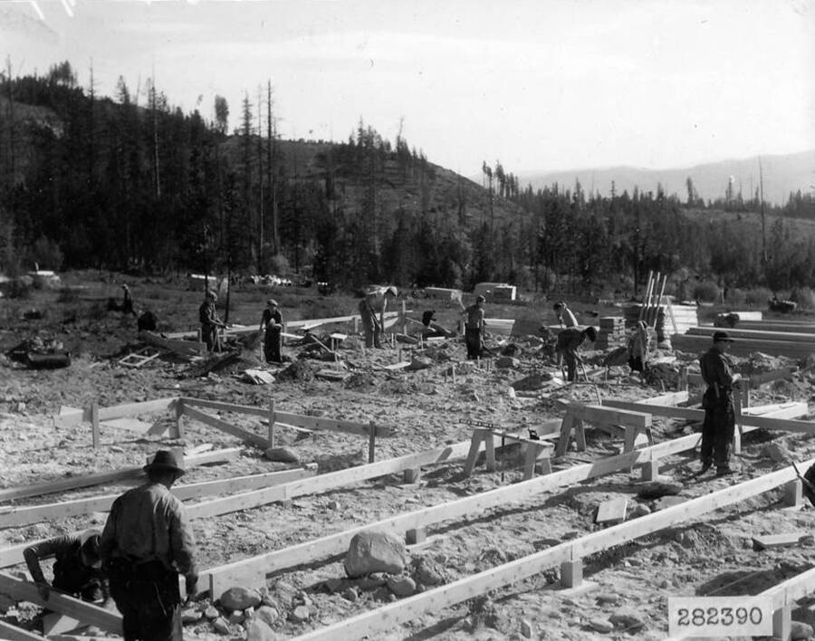 Several CCC men making the foundations for barracks at Remount Depot CCC Camp in the Lolo National Forest, Montana.