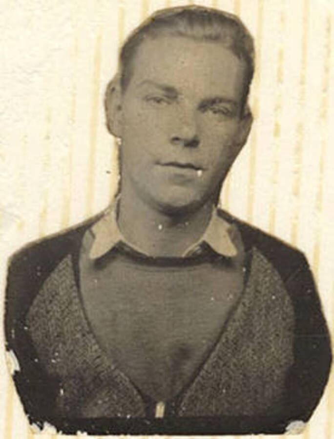 Portrait of Mike McKinney. Writing on Album Page reads: 'Mike and family photos'.
