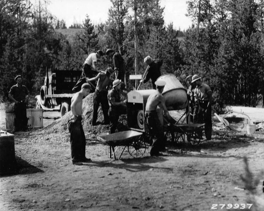 CCC Work Crew mixing cement for a guard station at Redfish Lake in the Sawtooth National Forest, Idaho. Back of photo says: 'Mixing Cement for guard station at Redfish Lake, Sawtooth National Forest, Idaho. Taken by K.D. Swan, 1933.