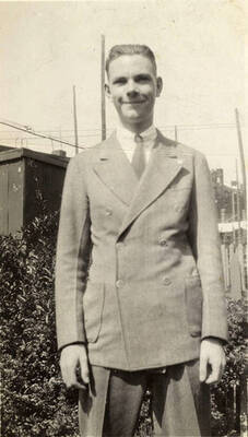Portrait of Mike McKinney. Writing on Album Page reads: 'Mike and family photos'.