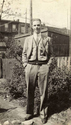 Portrait of Mike McKinney. Writing on Album Page reads: 'Mike and family photos'.