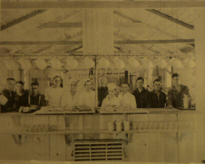 Kitchen and mess hall in unidentified camp location. Many kitchen and mess halls used the same architectural pattern and building materials.