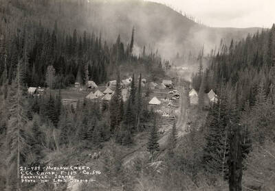 A view of Hudlow Creek CCC Camp. Writing on the photo reads: 'Hudlow Creek CCC Camp F-113 Company 546 Enaville, Idaho photo by Leo's Studio.'