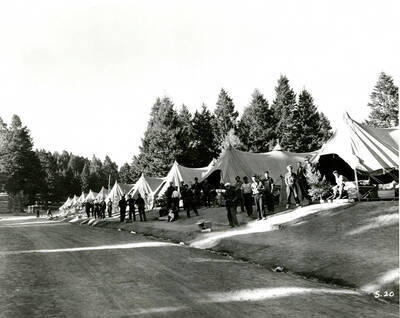 Tents and enrollees along road, Camp Shafer Butte. Identified as Spike  Camp Shafter Butte, Idaho on back