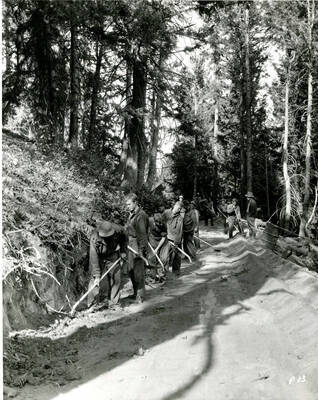 Photograph showing men with shovels working on the Payette Park Project, Shafer Butte, Idaho; ' Reverse side reads: 'Big Payette [illegible] Shafer Butte Ida. McCall