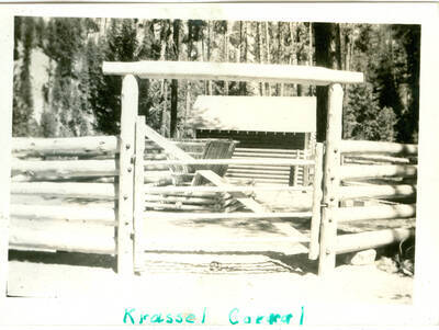 Picture from photo album of a poll corral. Handwritten caption: 'Krassel Corral'.  This is likely to be located at Camp Creek, South Fork of the Salmon River, which built Krassel Ranger Station.