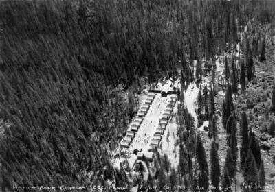 An aerial view of Camp Four Corners, F-164, Company 533, Priest River, Idaho. Writing on the photo says: 'Four Corners CCC Camp F-164 Co. 533 Air photo by Leo's Studio.'