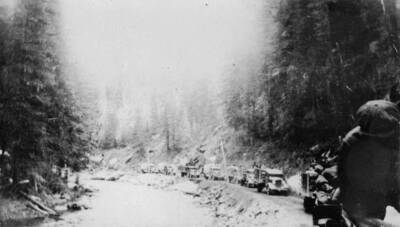 Trucks, hauling men and supplies, arriving at CCC Camp Pine Creek, near Pierce, Idaho.