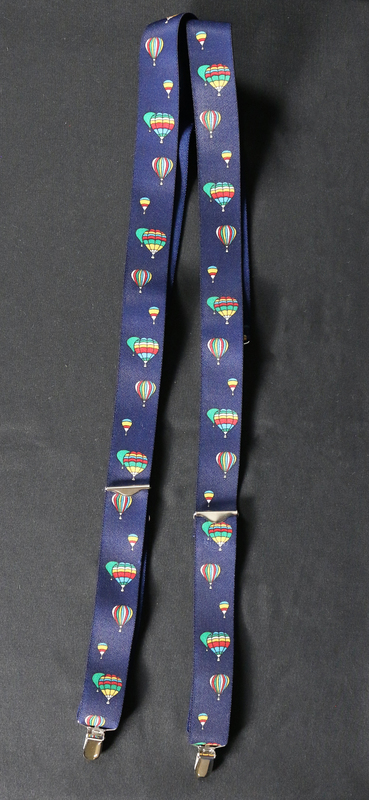 Navy blue suspenders with rainbow color hot air balloons motif.