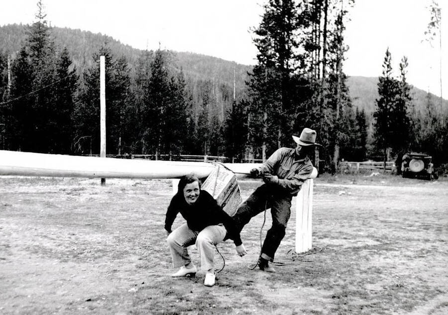 Pick Ward and Kay Flores posed at hitching rail. Dixie, Idaho.
