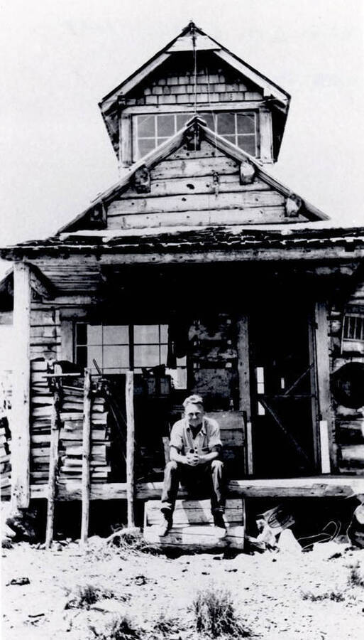 Everett Haney seated on front porch