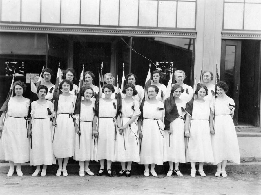 The Bovill Ladies Club at the Macabee Convention at Coeur d'Alene, ID. Front, l to r: Mabel White, Maud Frick, June Clark Hanson, Anna Hays, Laura Chilton, Esther Chilton, Louise Hale, Lizette Miller Munsch, Nellie Smith, Kate Wallen Back row, l to r: Maud Greenwood, Orpha Chrystal, May Denevon, ?, Wingarde, Lori Boll, Edith Bailey, Mae Tarbox, Emma Galloway