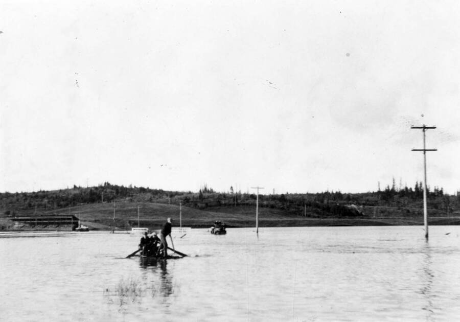 Electric crew in a boat during the Bovill flood of 1933.