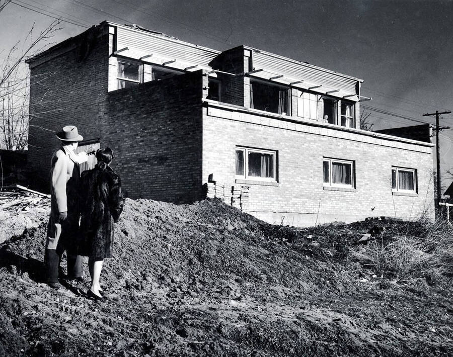 W. Friberg and wife in front of home. Moscow, Idaho.