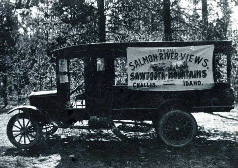 Truck with sign 'For Sale. Salmon-River Views. Sawtooth Mountains. Challis, Idaho'.