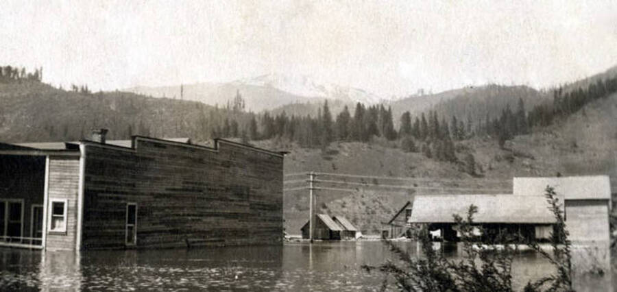 Flood. Hardware store on left, Dittman house on right. Ferrel, Idaho.