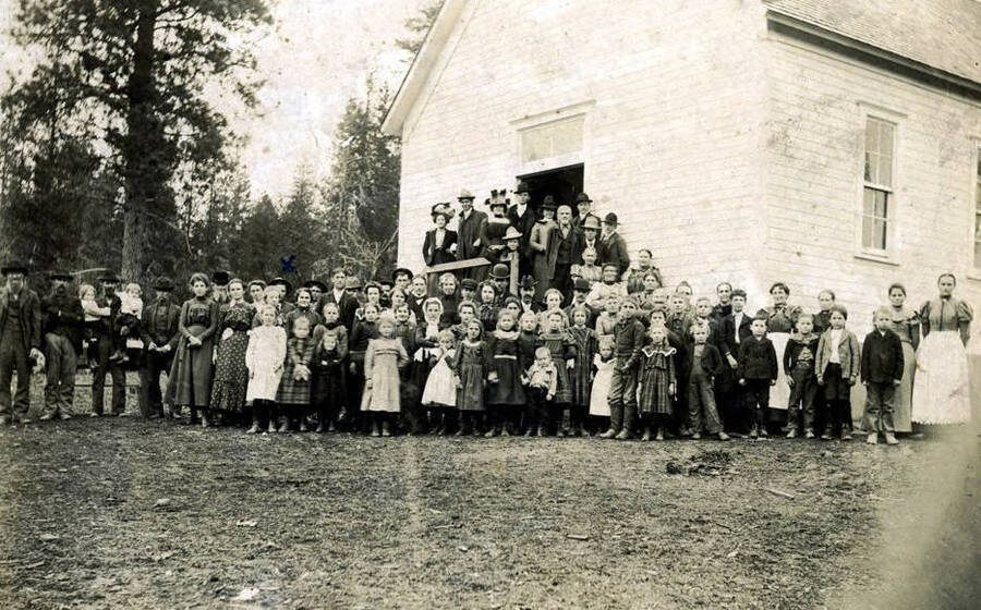 Sunday School group standing in front of church building. Avon, Idaho.