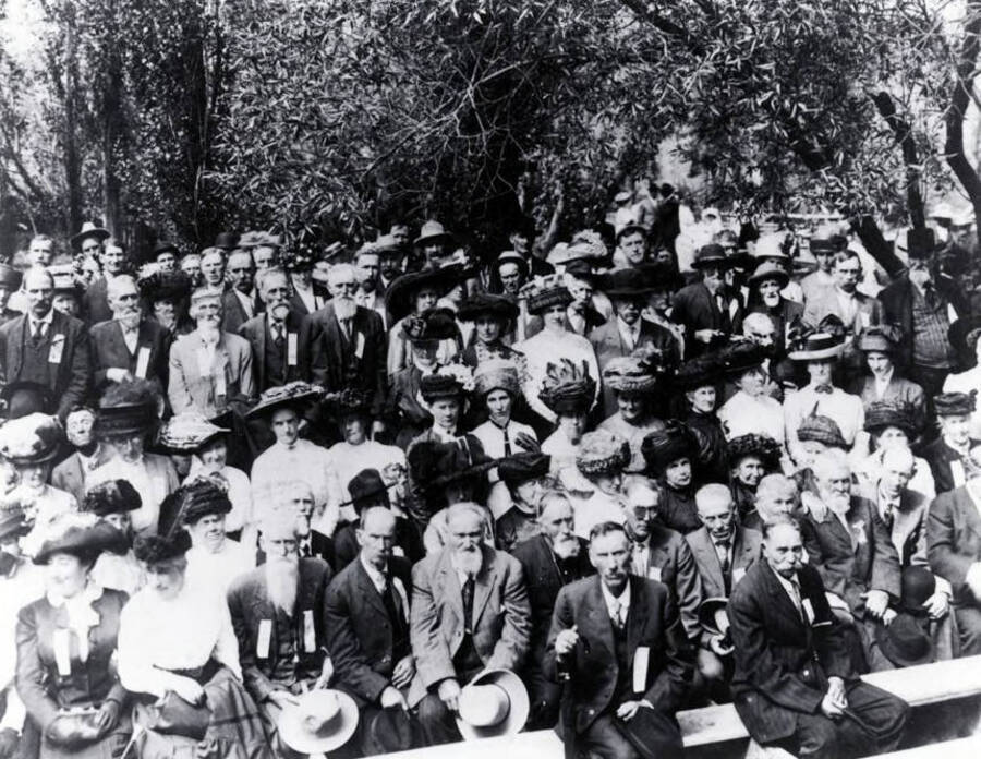 Large group of men and women on an outing. Hall's Grove? Grangeville?, Idaho.