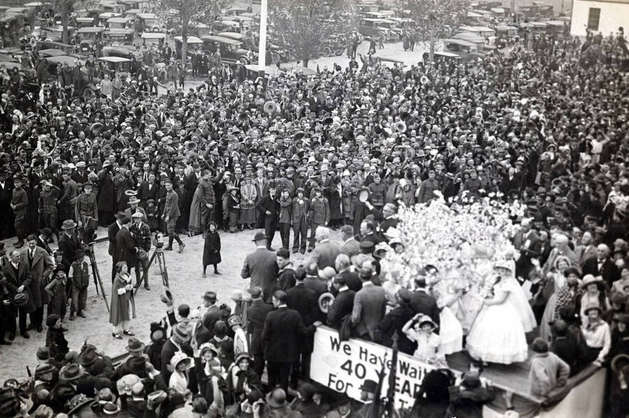 Apple Blossom girls and dignitaries in right foreground. Celebration of coming of Union Pacific main line to Boise. Boise, Idaho.
