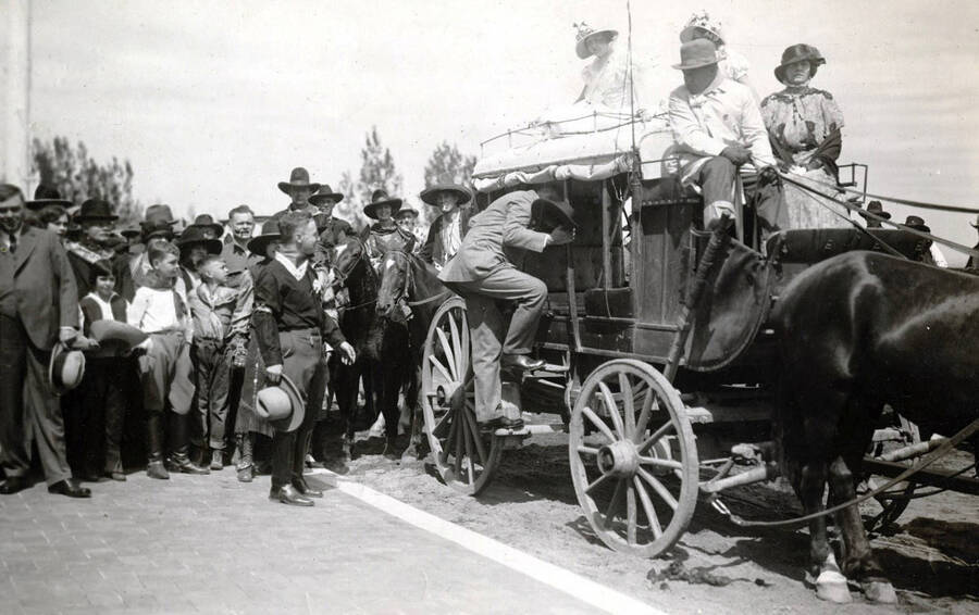 U.P. President Carl R. Gray riding in old stagecoach. Celebration of coming of Union Pacific main line to Boise. Boise, Idaho.