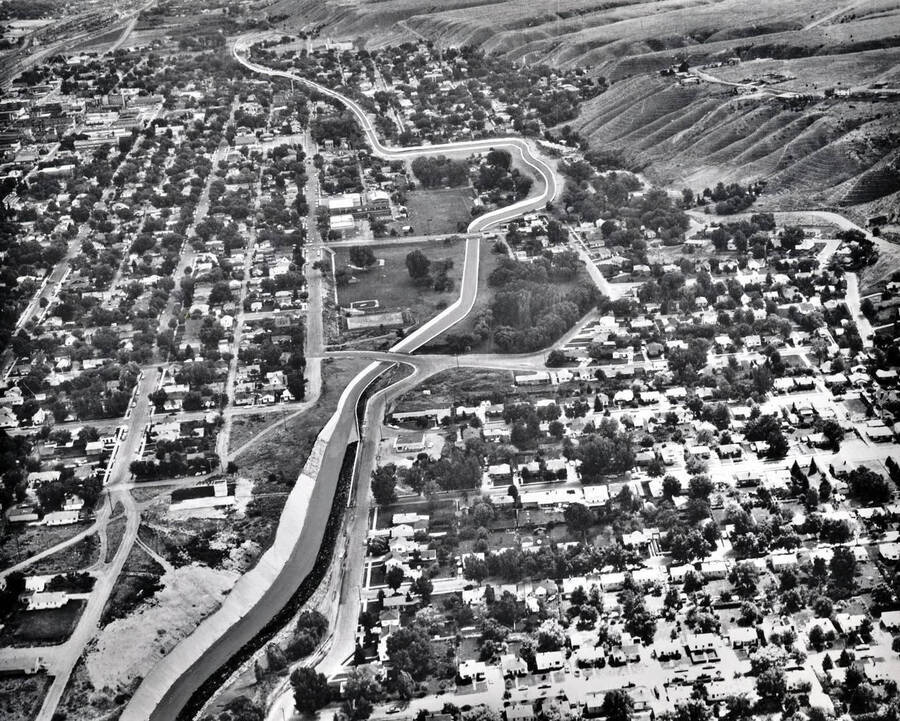 Aerial view showing artist's conception of flood control project, looking upstream on Portneuf River and Marsh Creek. Pocatello, Idaho.