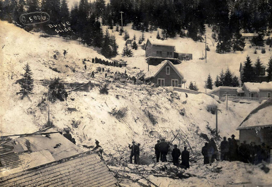 Group of people gathered at Hercules Mine after snowslide. Burke, Idaho.