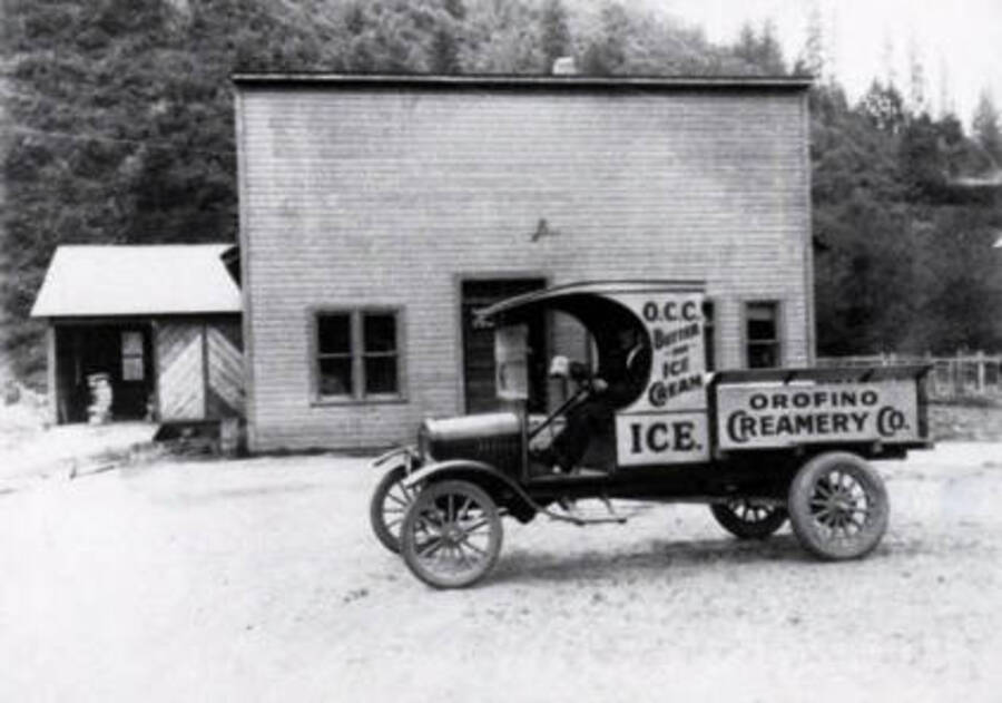 Sign on truck reads 'O.C.C. Butter and Ice Cream. Ice.'