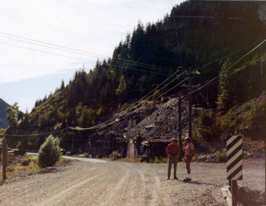 Bill Etherton and Dave Osterberg standing along road in the canyon. Upper Burke Canyon. Idaho.