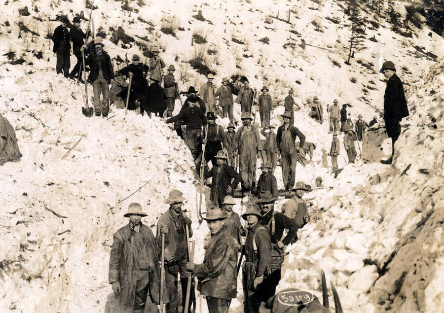 Men digging out after the snowslide. Mace, Idaho.