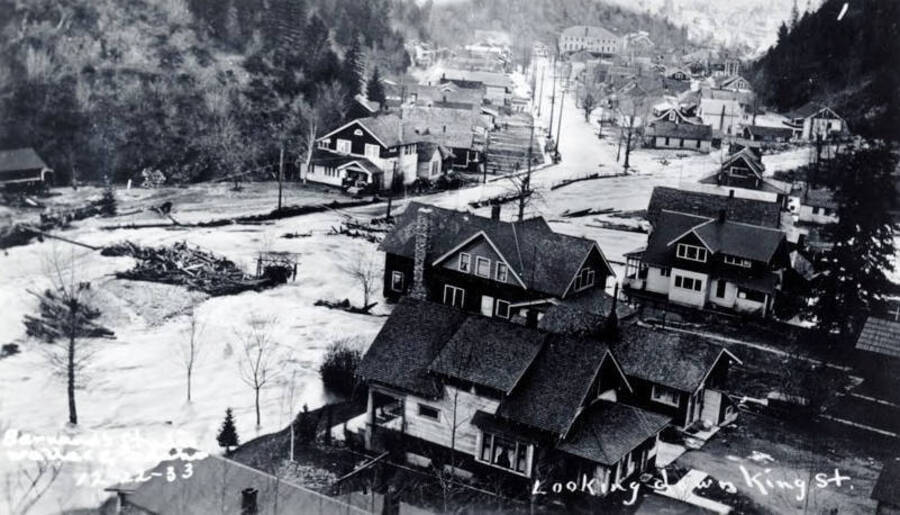 Looking up King Street from the junction of Placer Creek on the main South Fork of the Coeur D'Alene River. Placer Creek Flood. Wallace, Idaho.